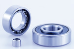 Bearing with extended inner or outer ring